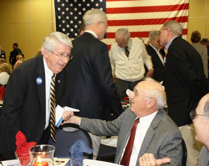 State Senator Ken Winters, left, greets friends