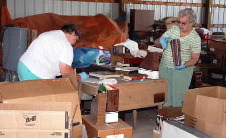 Society members LaDonna Lathem and Norma Gene Humphreys search through salvaged records