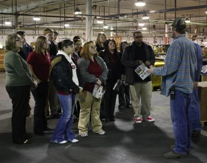 Students are briefed during factory tour