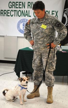 Sgt. Jennifer Grooms accepts her new canine Roscoe